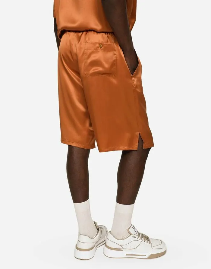 Dolce and Gabbana Trousers And Shorts Men Silk Satin Jogging Shorts With Metal DG Logo Beige Dolce and Gabbana Trousers And Shorts Men Silk Satin Jogging Shorts With Metal DG Logo Beige