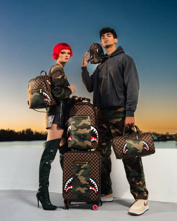 SPRAYGROUND EXTERIOR GOLD ZIP POCKET SHARKS IN PARIS BACKPACK SLING Bags